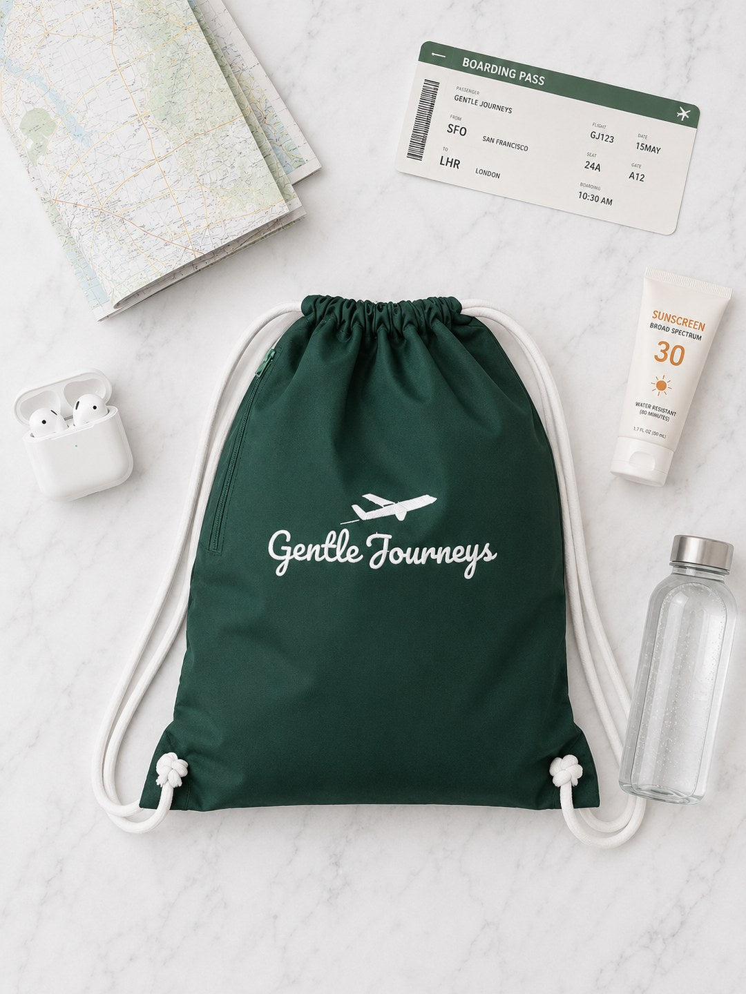 Green wipe-clean water-resistant sensory bag flat lay with travel essentials