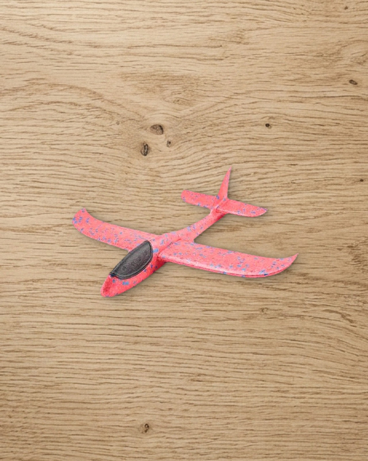 The pink speckled foam glider plane
