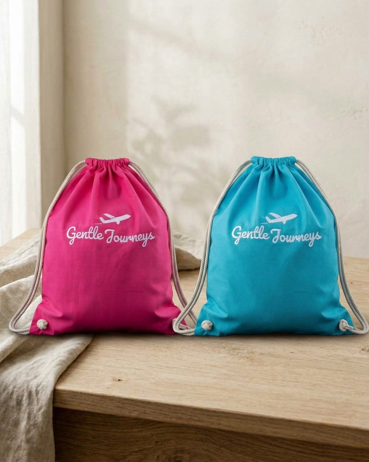 The pink and blue Soft Cotton sensory travel bags side by side