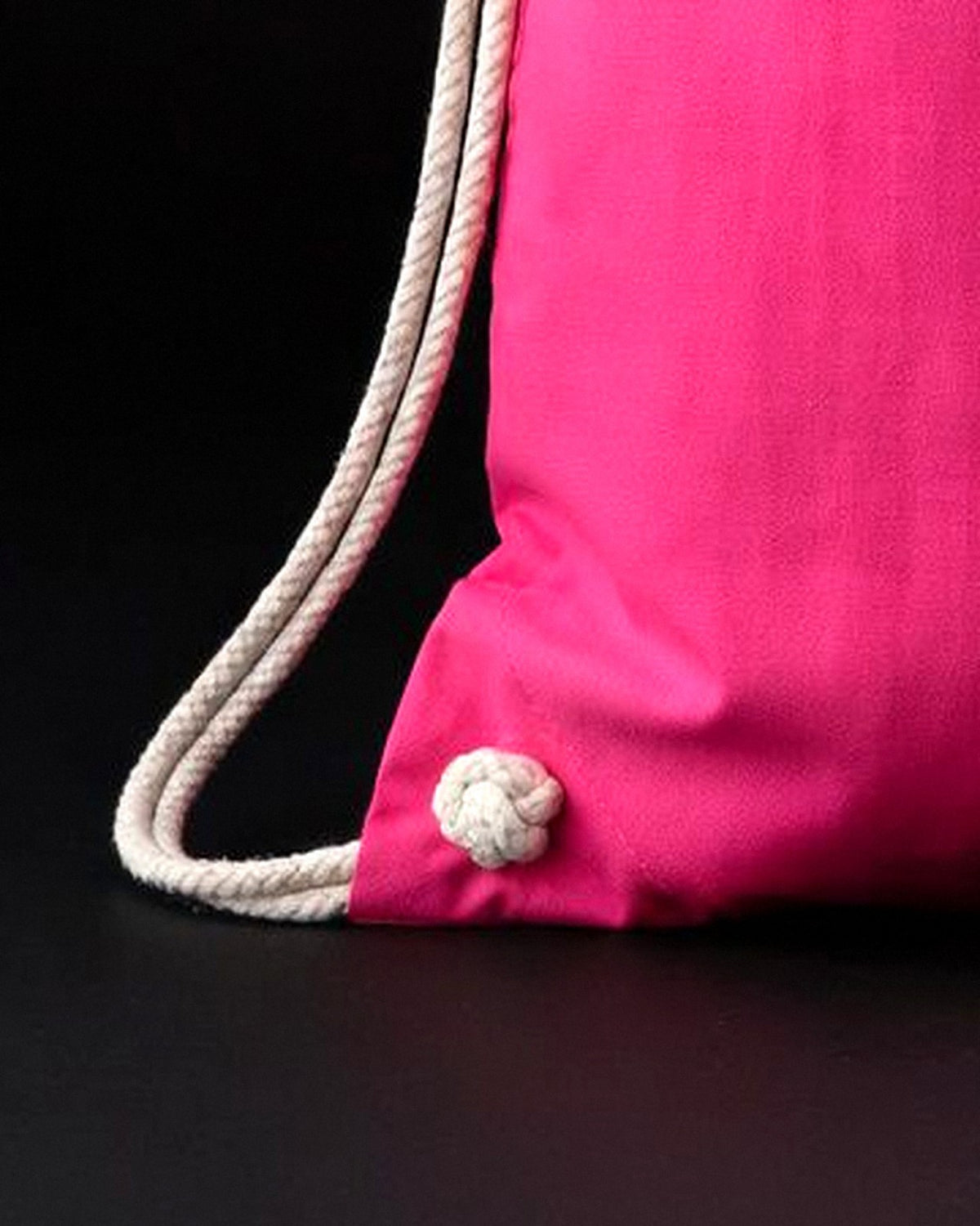 Close-up of the white soft cotton cords on the pink Soft Cotton sensory travel bag