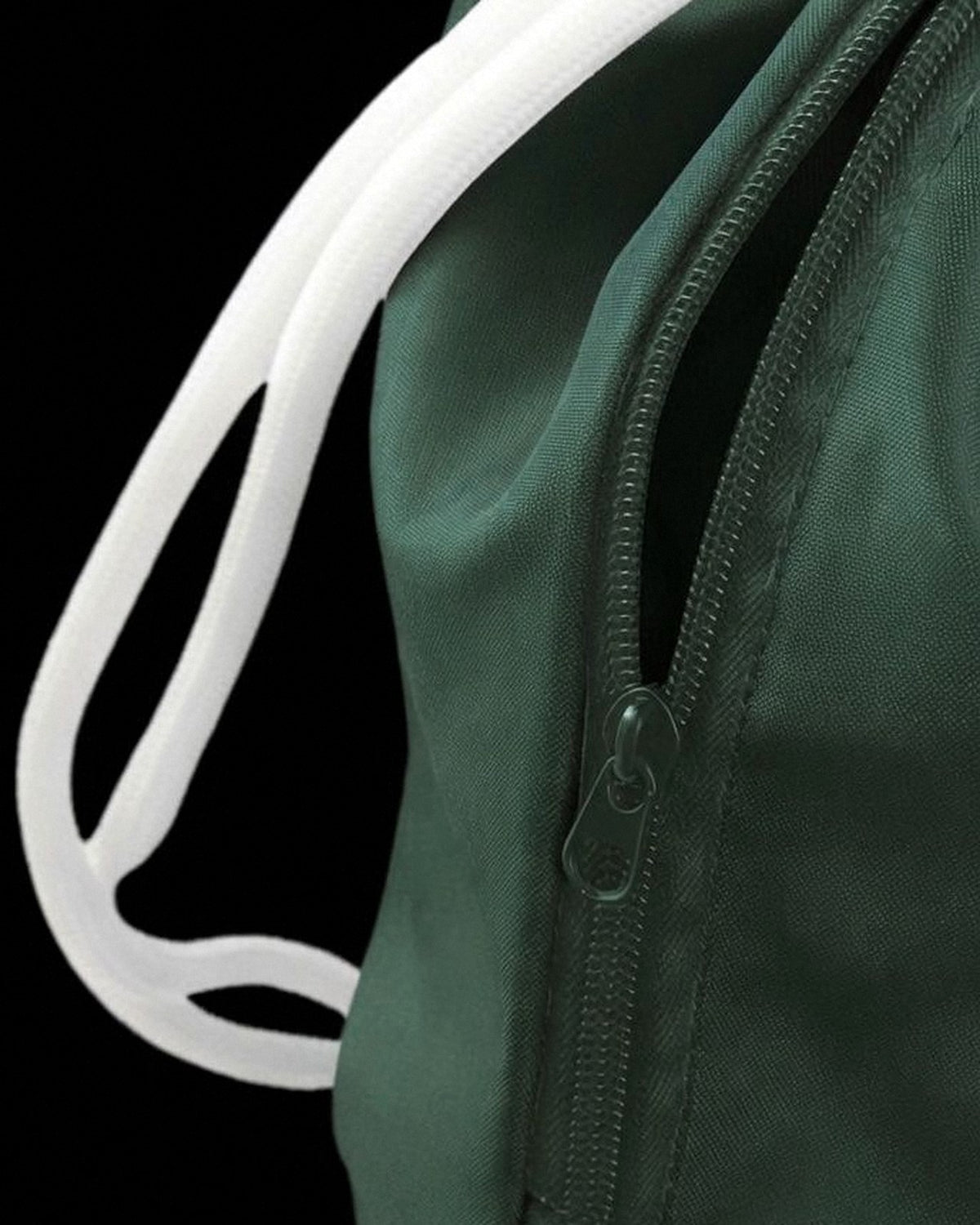 Close-up of the side zip pocket on the green Water-Resistant sensory travel bag
