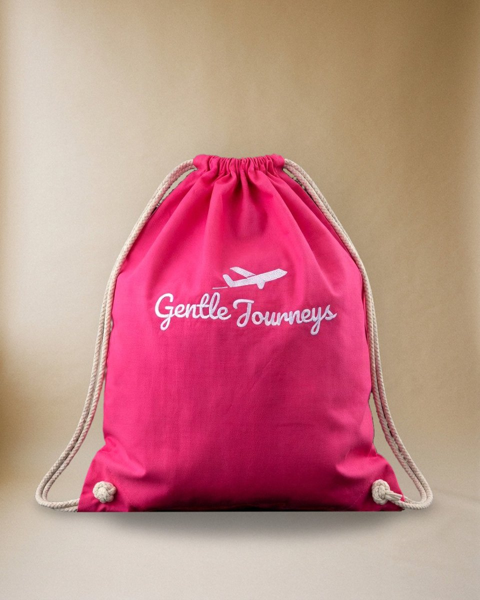 Pink Soft Cotton sensory travel bag, front view with the embroidered Gentle Journeys logo
